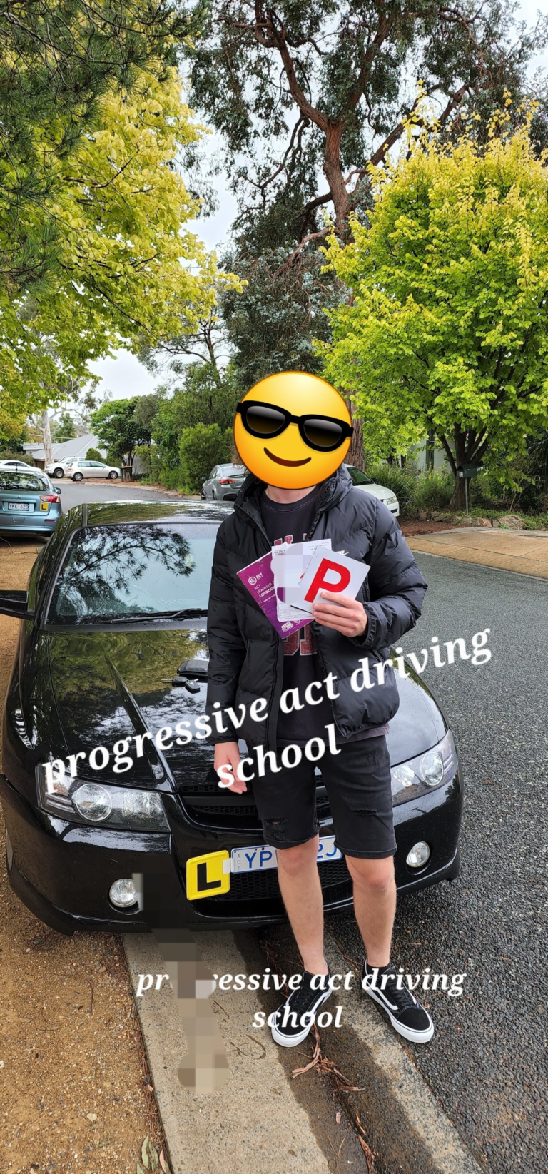 Canberra student holding P plates after passing the ACT driving test